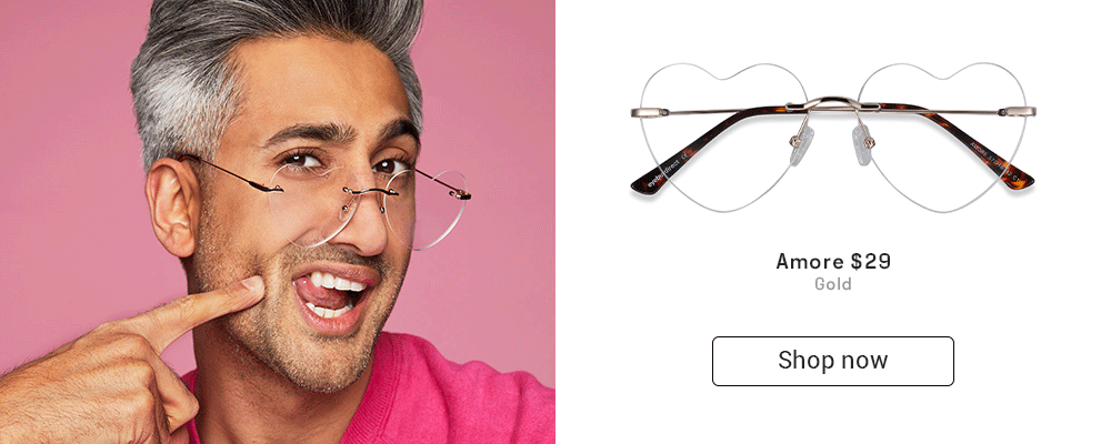 Tan France in a pink sweater and Amore eyeglasses