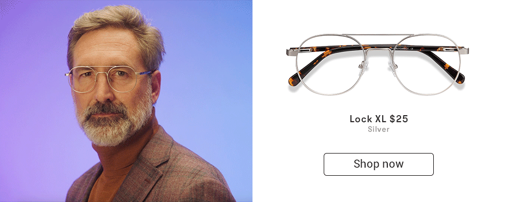 A man with gray hair wearing silver aviator eyeglasses