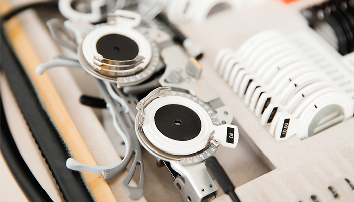 A set of adjustable glasses used for eye exams